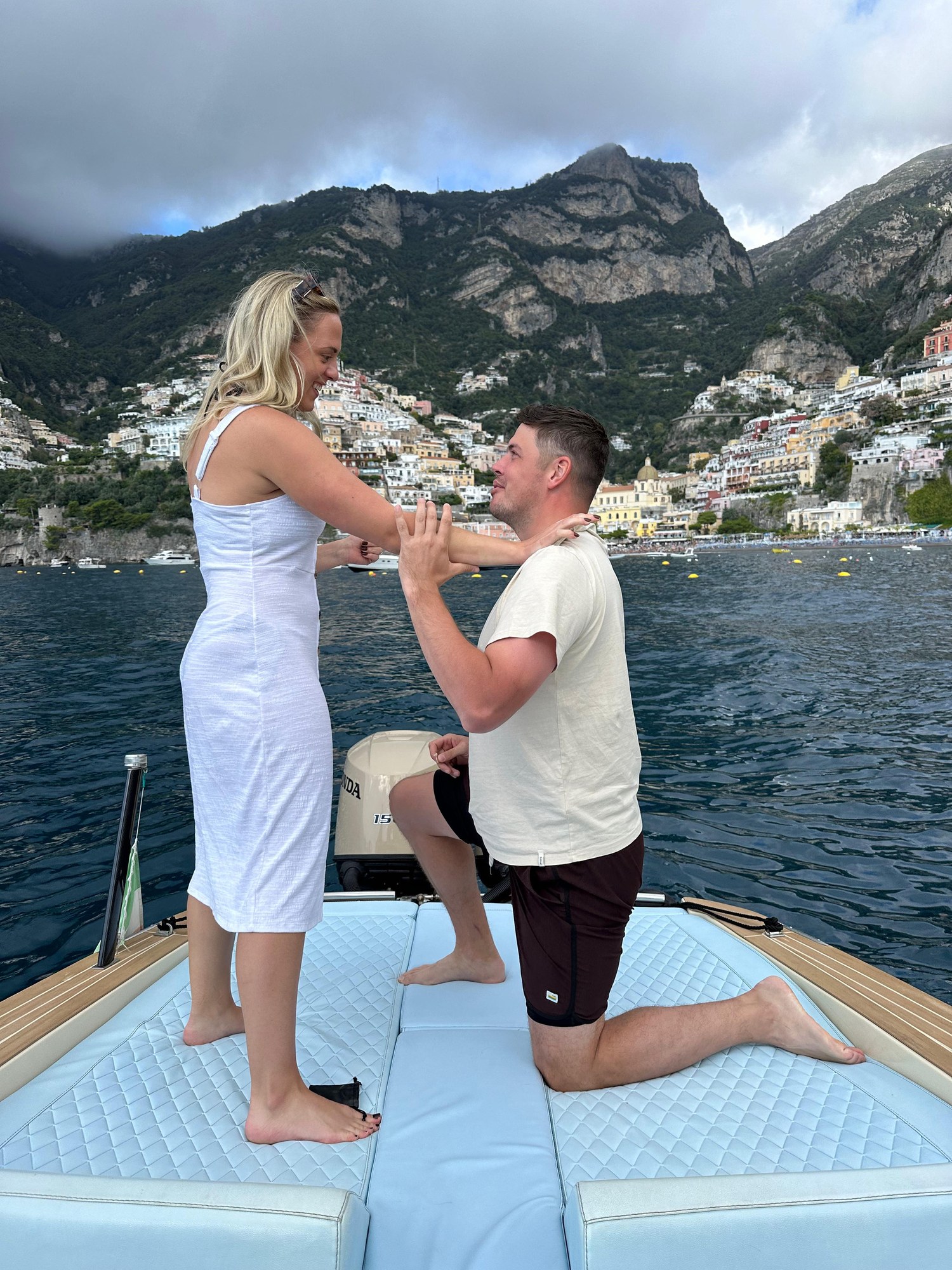A proposal on the bow, Positano behind
