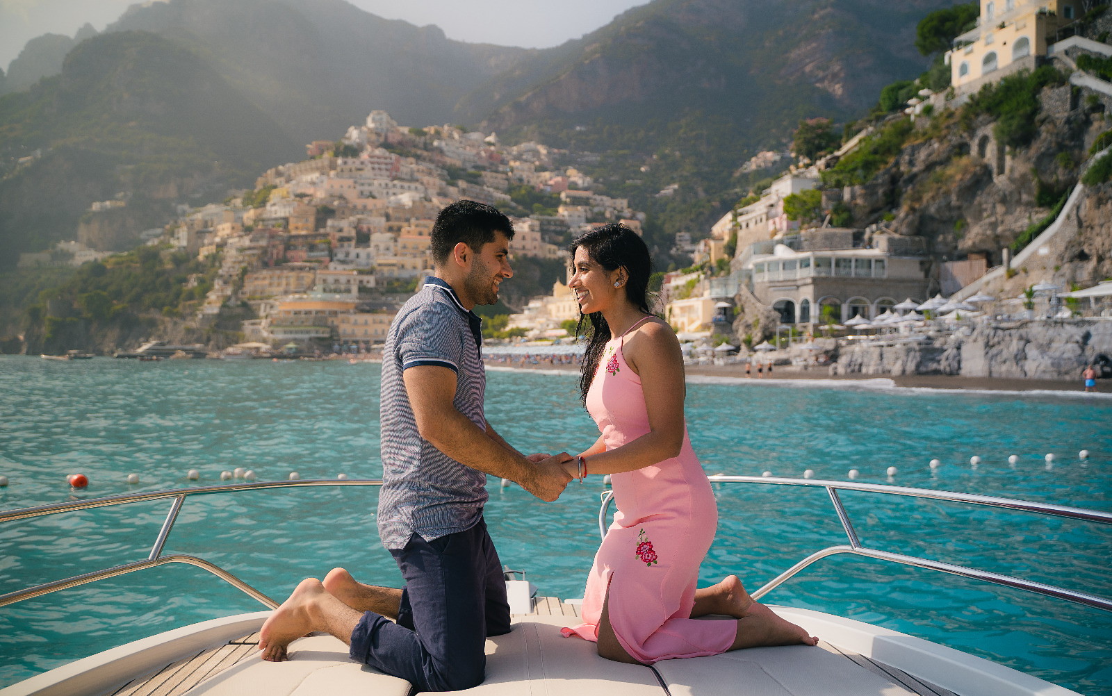 A proposal on the bow, the coast behind